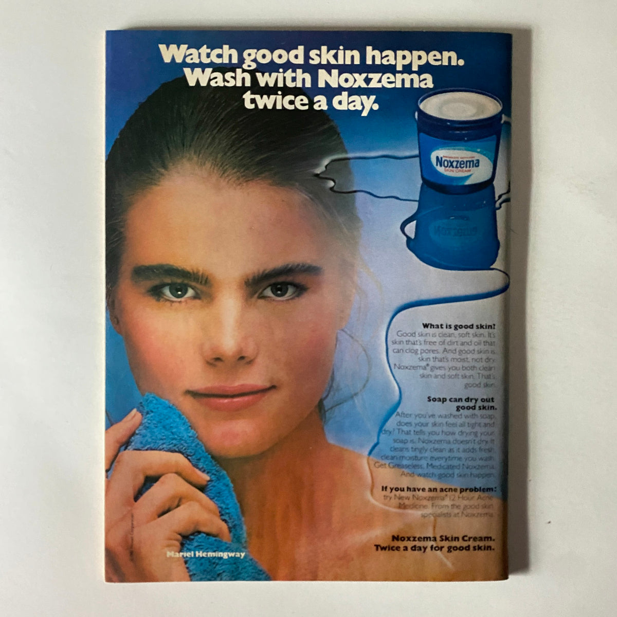 Vintage Noxzema advertisement featuring model Mariel Hemingway promoting good skin care. The ad displays the message 'Watch good skin happen. Wash with Noxzema twice a day,' along with an image of a Noxzema skin cream container and tips about skincare.
