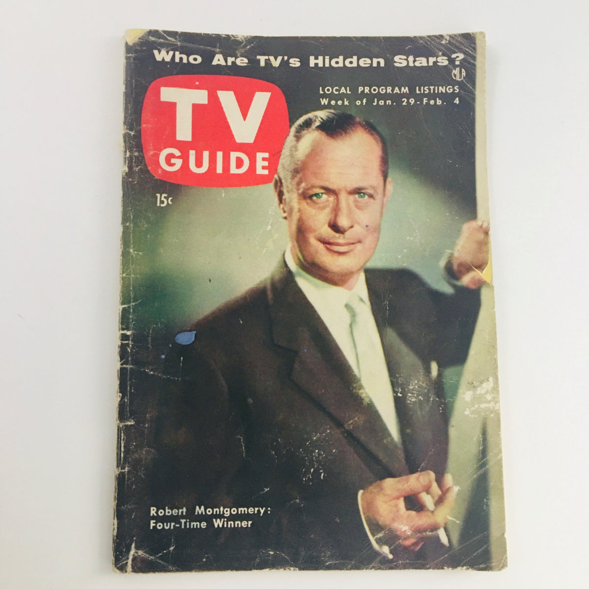 Cover of TV Guide Magazine January 29, 1954 Vol 2 #5 featuring film actor Robert Montgomery with the headline 'Who Are TV's Hidden Stars?'. The magazine is in worn condition, showing age and wear but retains nostalgic value for collectors.