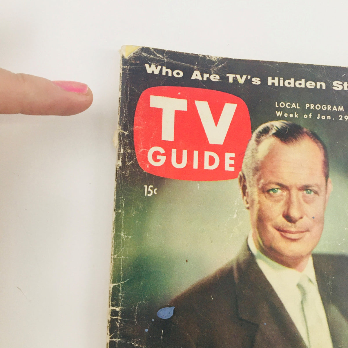 Close-up of the TV Guide Magazine January 29, 1954 Vol 2 #5 cover focusing on Robert Montgomery's portrait, highlighting the magazine's vintage essence and features key text like '15c' and 'Who Are TV's Hidden Stars?'.