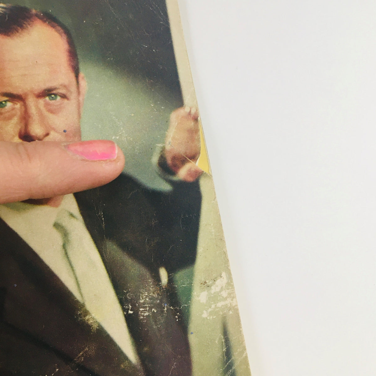 Another angle of the TV Guide Magazine January 29, 1954 Vol 2 #5 cover showing Robert Montgomery pointing, emphasizing the age-worn details of the publication while preserving its collectible charm.