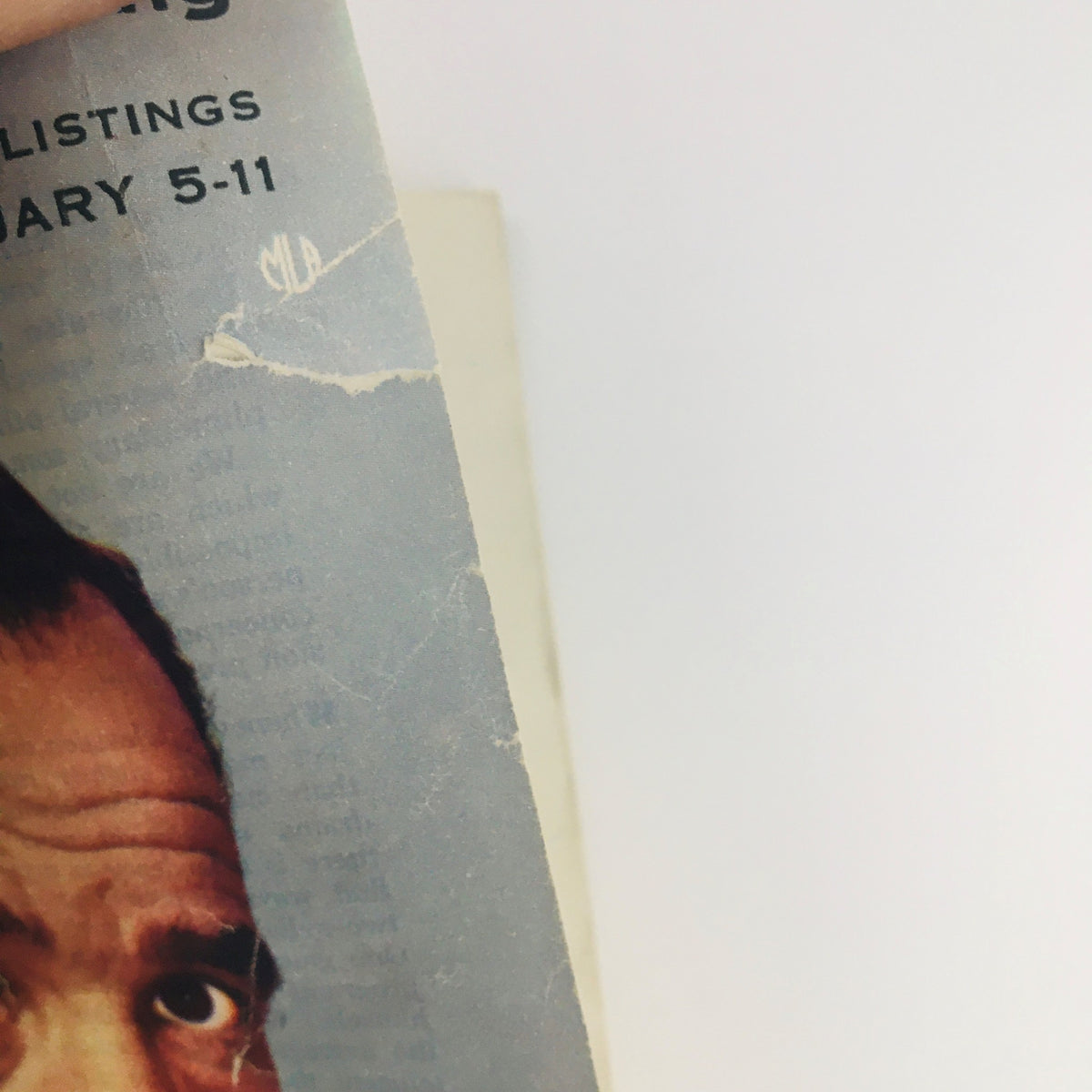 Close-up view of the cover of TV Guide Magazine, February 5, 1955, Vol 3 #6, showing a prominent image of Edward R. Murrow with a cigarette, showcasing vintage television history.