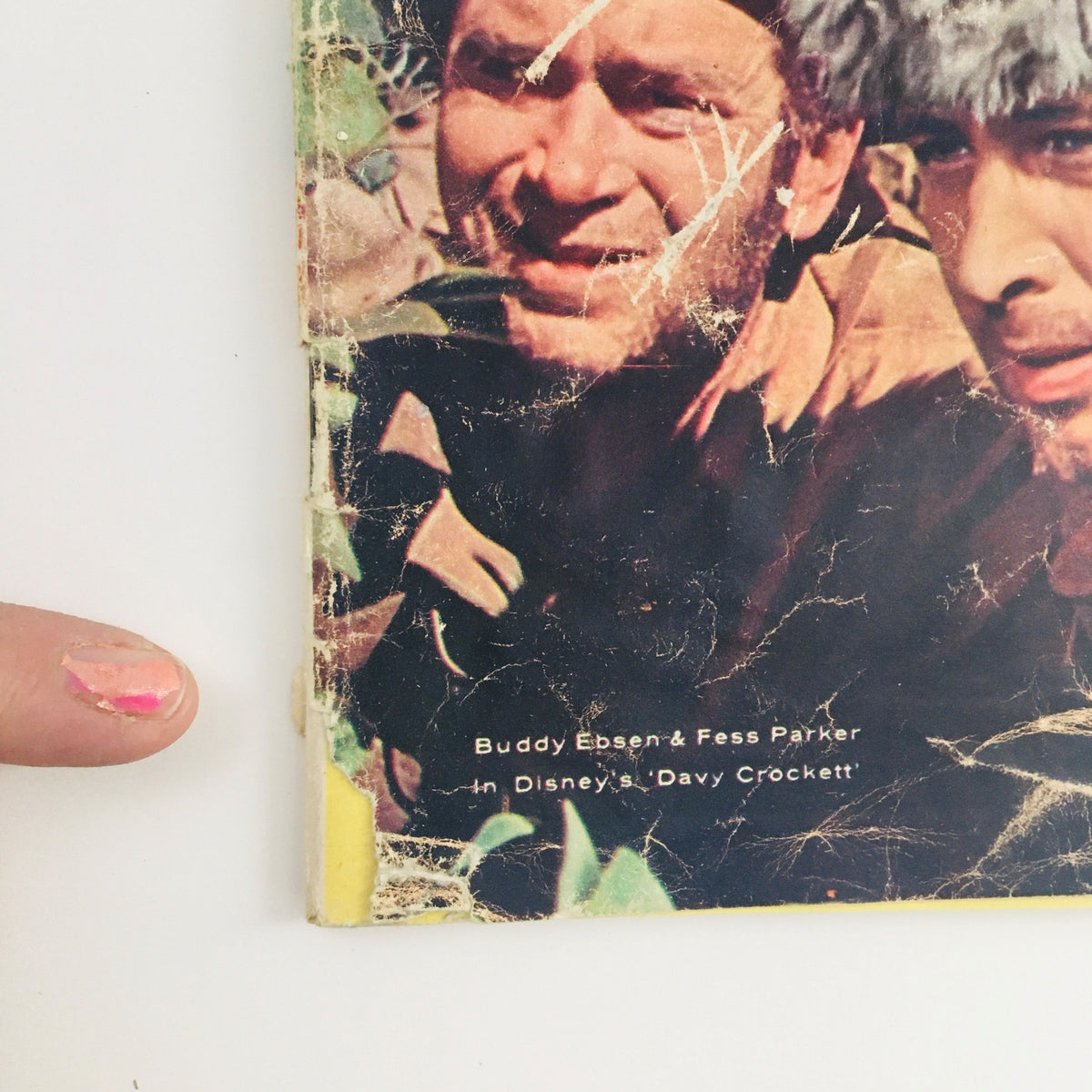 Close-up of the cover of TV Guide Magazine April 30 1955, highlighting Buddy Ebsen and Fess Parker in character from Disney's Davy Crockett.