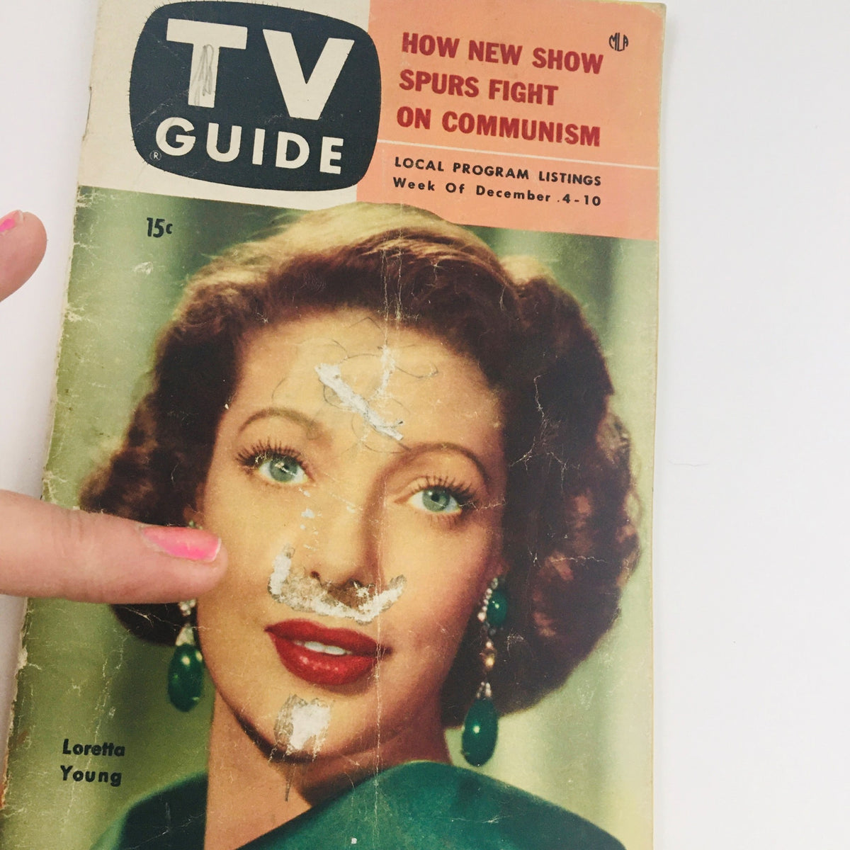 Close-up of TV Guide Magazine December 4, 1953 cover highlighting actress Loretta Young, with visible wear and details.