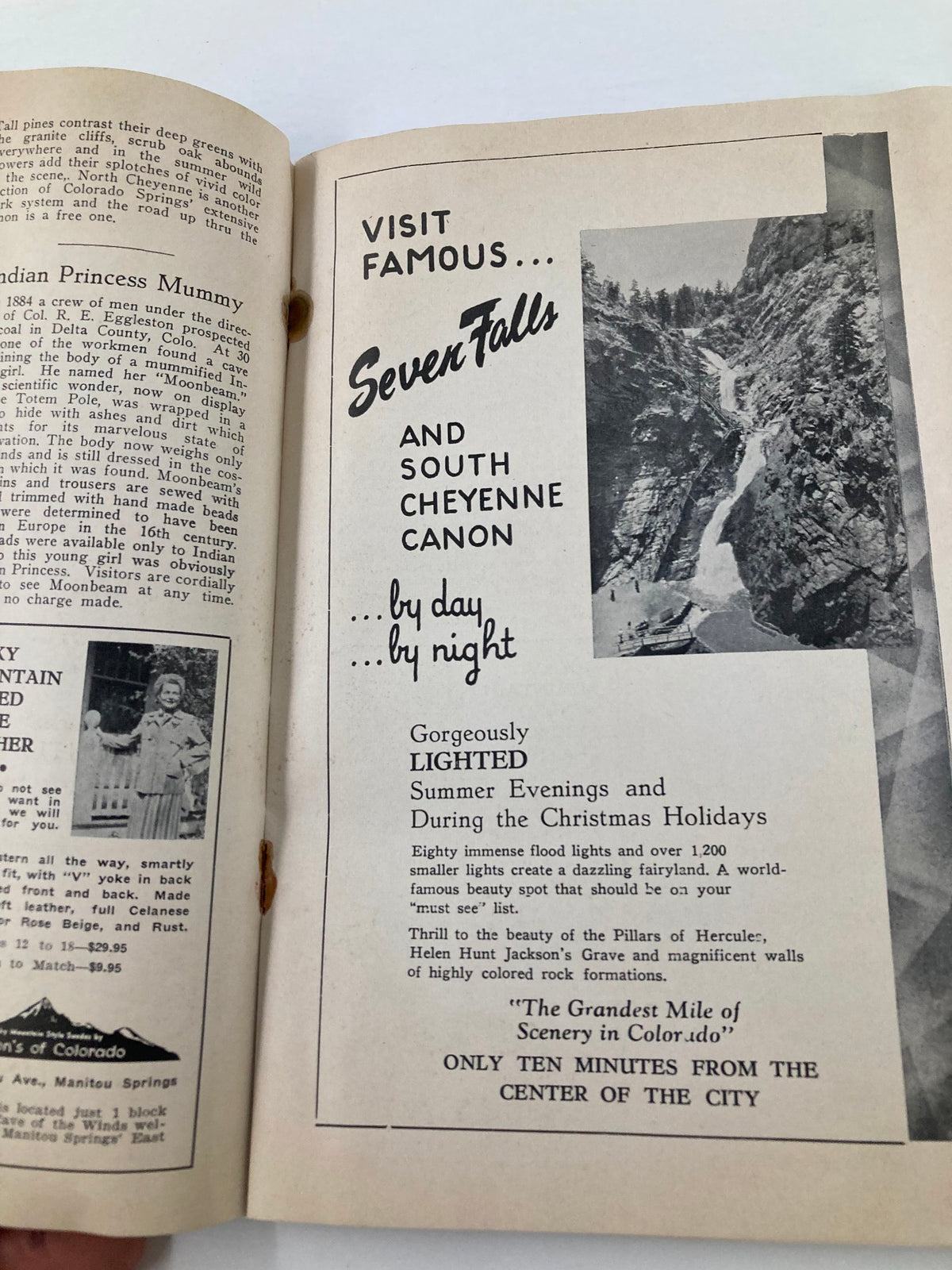 Vintage Pikes Peak or Burst Magazine July 2, 1951 showcases an advertisement for Seven Falls and South Cheyenne Canon, highlighting summer evenings and Christmas holidays with picturesque visuals.