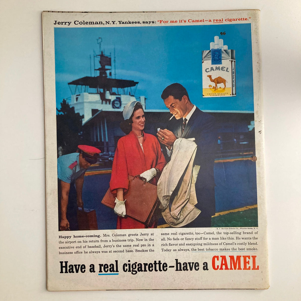 Advertisement from Look Magazine December 9, 1958 featuring a couple at the airport, promoting Camel cigarettes, enhancing the vintage theme.
