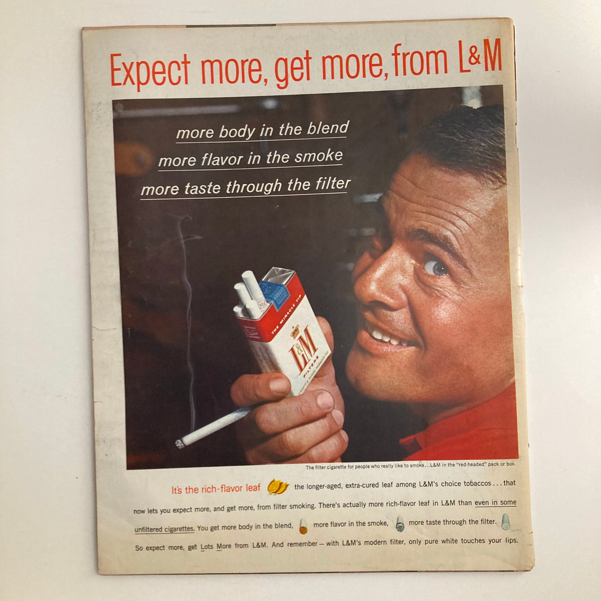 Back cover of the VTG Look Magazine February 13 1962 Vol 26 No. 4 featuring an advertisement for L&M cigarettes with a smiling man holding a pack, highlighting product features.