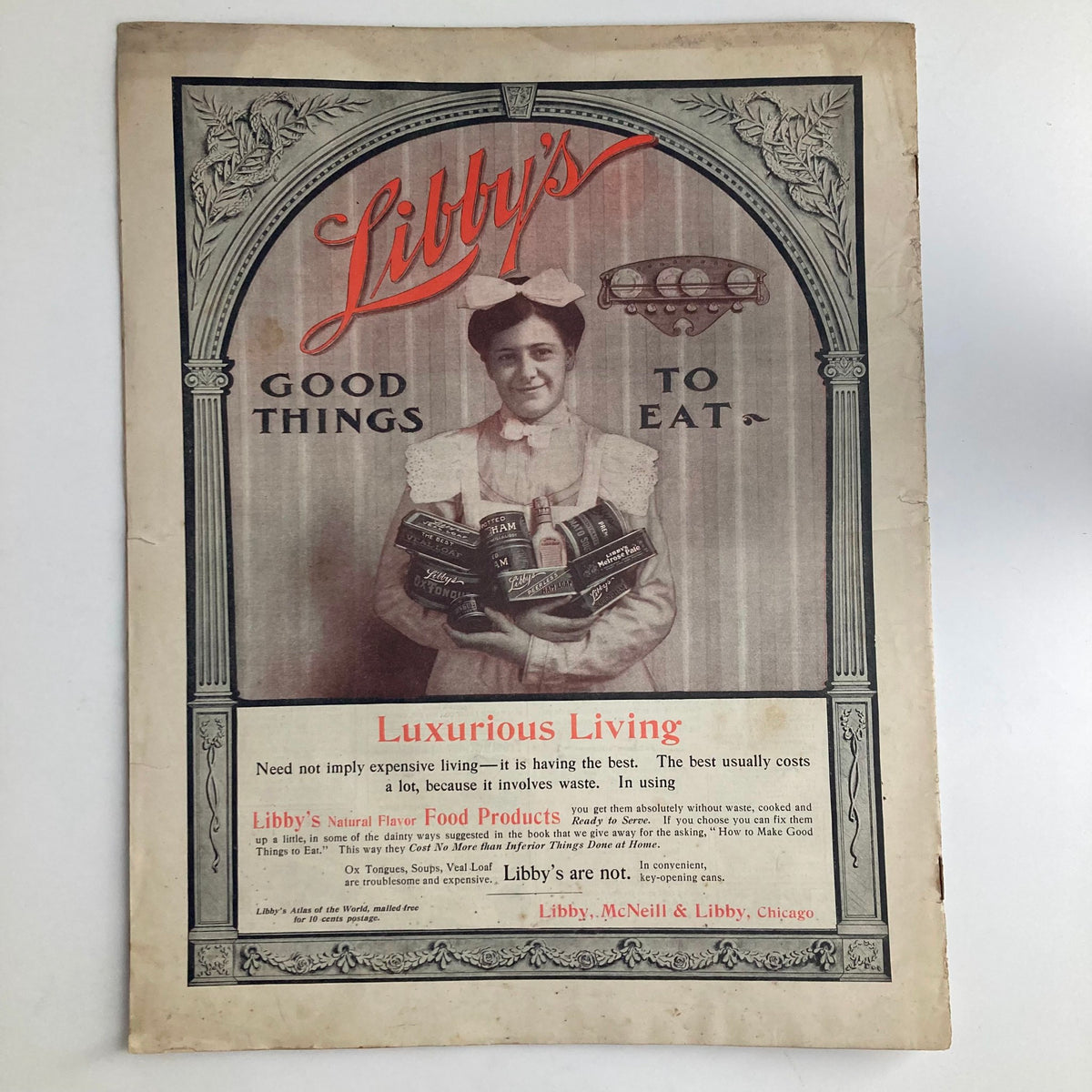 The cover page of Libby's advertisement in the Saturday Evening Post Magazine April 5 1902, featuring a woman surrounded by food products, highlighting the brand and its emphasis on quality and luxurious living.