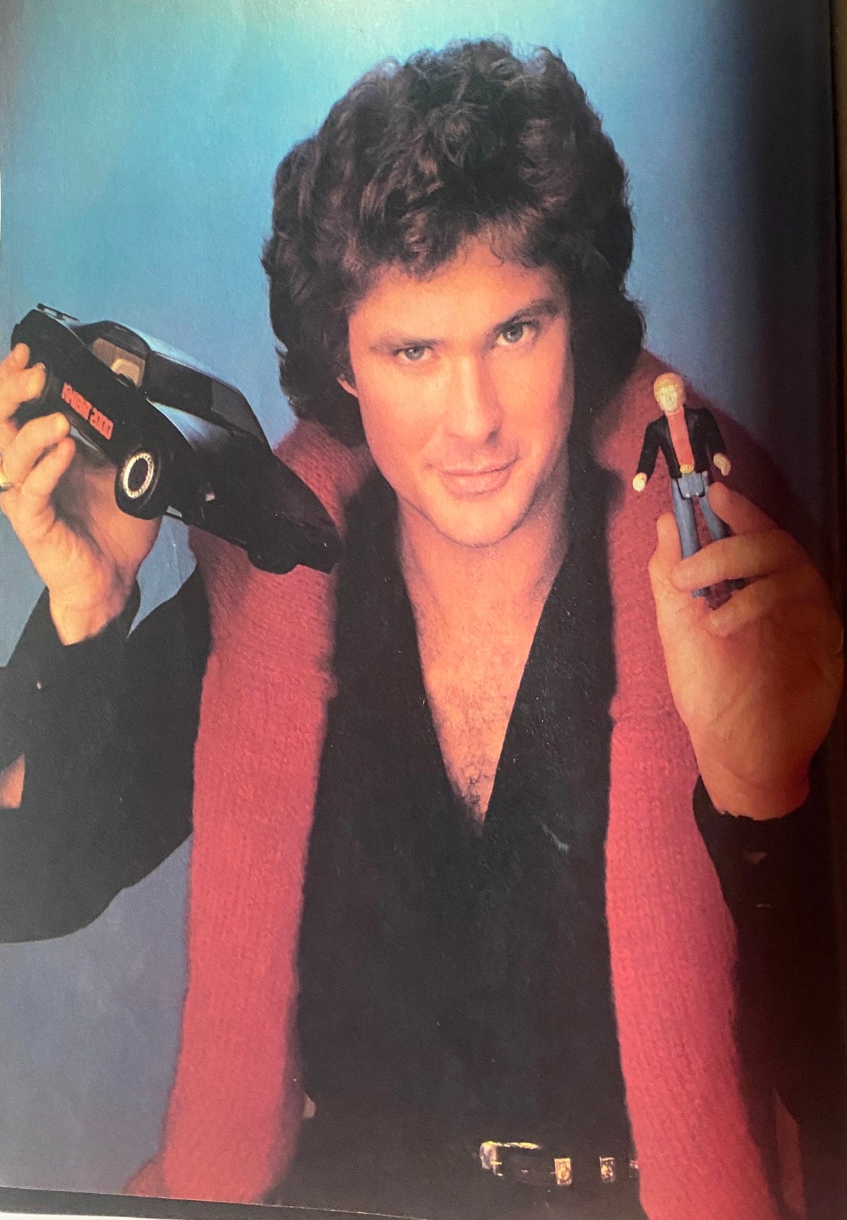 David Hasselhoff holding a toy car and figure, showcasing his persona in Teen Beat Magazine February 1984.