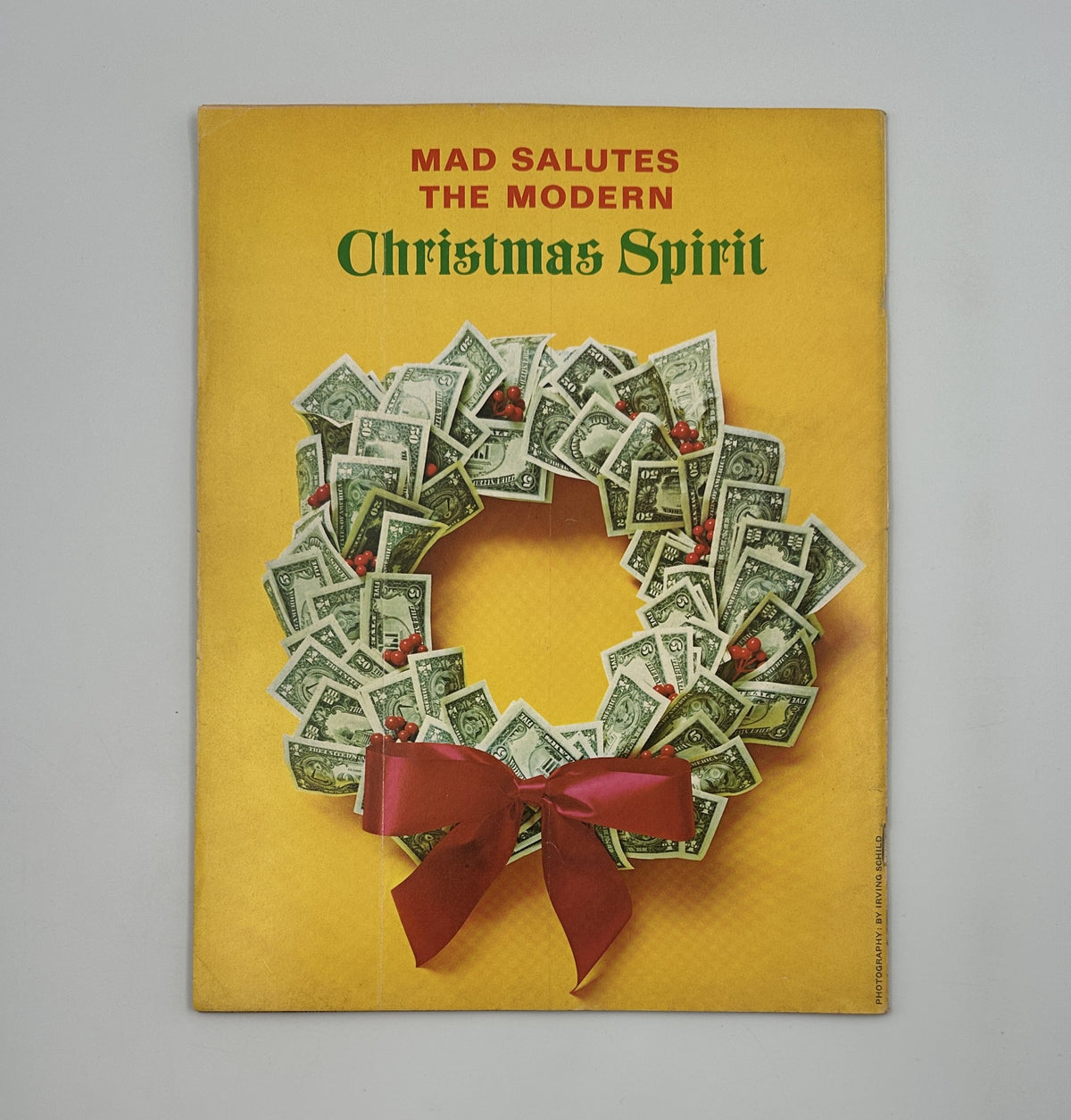 Back cover of MAD Magazine No. 156 January 1973 featuring a vibrant Christmas-themed illustration depicting a wreath made of dollar bills with the text 'MAD Salutes the Modern Christmas Spirit'.