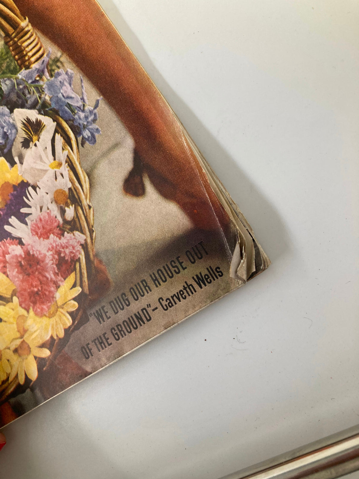 Close-up of the corner of the Better Homes & Gardens Magazine from August 1939, showcasing the title "We Dug Our House Of The Ground" along with minor wear typical for its vintage condition.