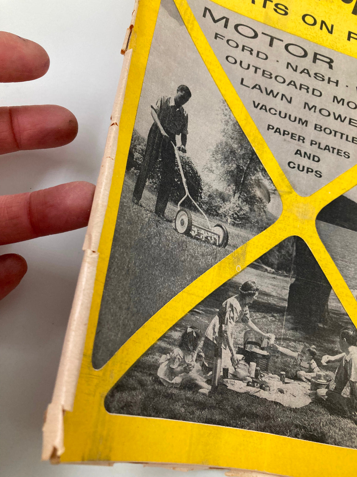 Close-up view of the July 1954 Consumer Reports Magazine showcasing the cover's yellow layout with motor oils and outdoor imagery, highlighting Ford, Nash, and Willys.