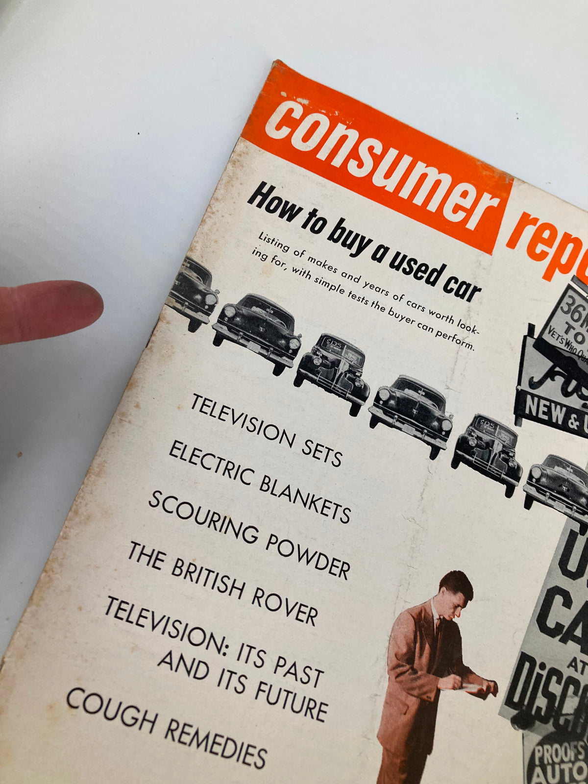 Close-up of the cover of VTG Consumer Reports Magazine January 1954 highlighting articles on television, electric blankets, and other consumer topics.