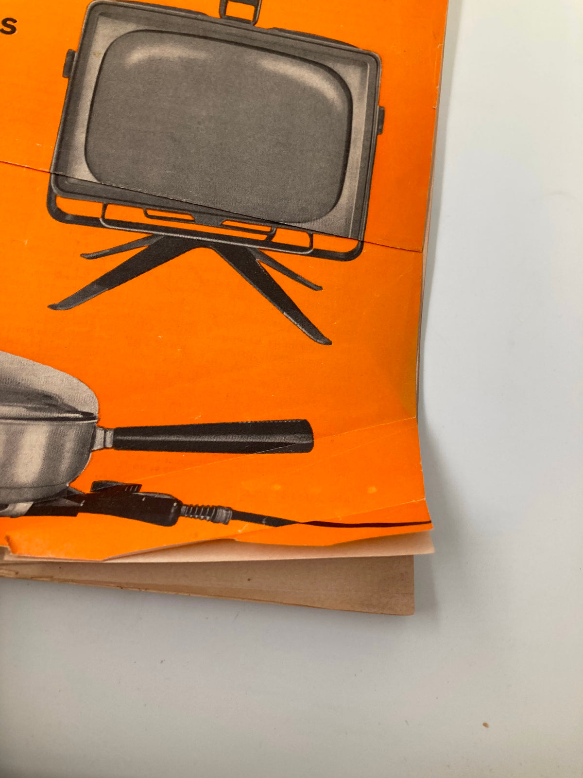 Detailed view of the cover of Vintage Consumer Reports Magazine August 1956, displaying a vintage TV and frying pan, illustrating consumer reports of household products.