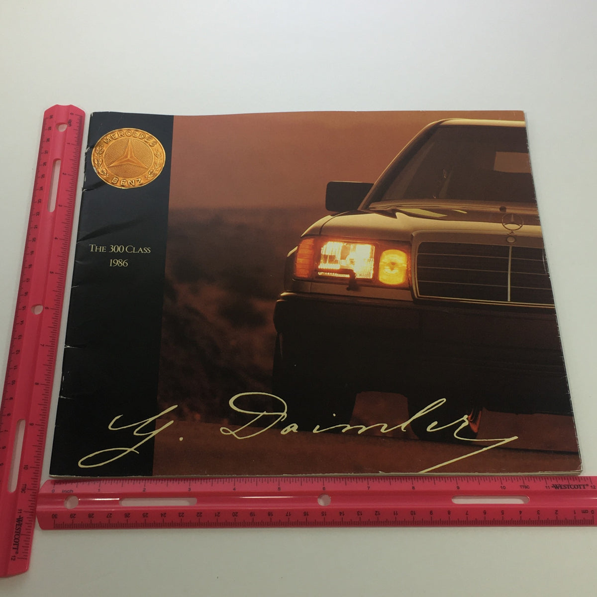 Inside view of the 1986 Mercedes-Benz 300 Class brochure featuring an image of the car, highlighting its luxury features and iconic design.