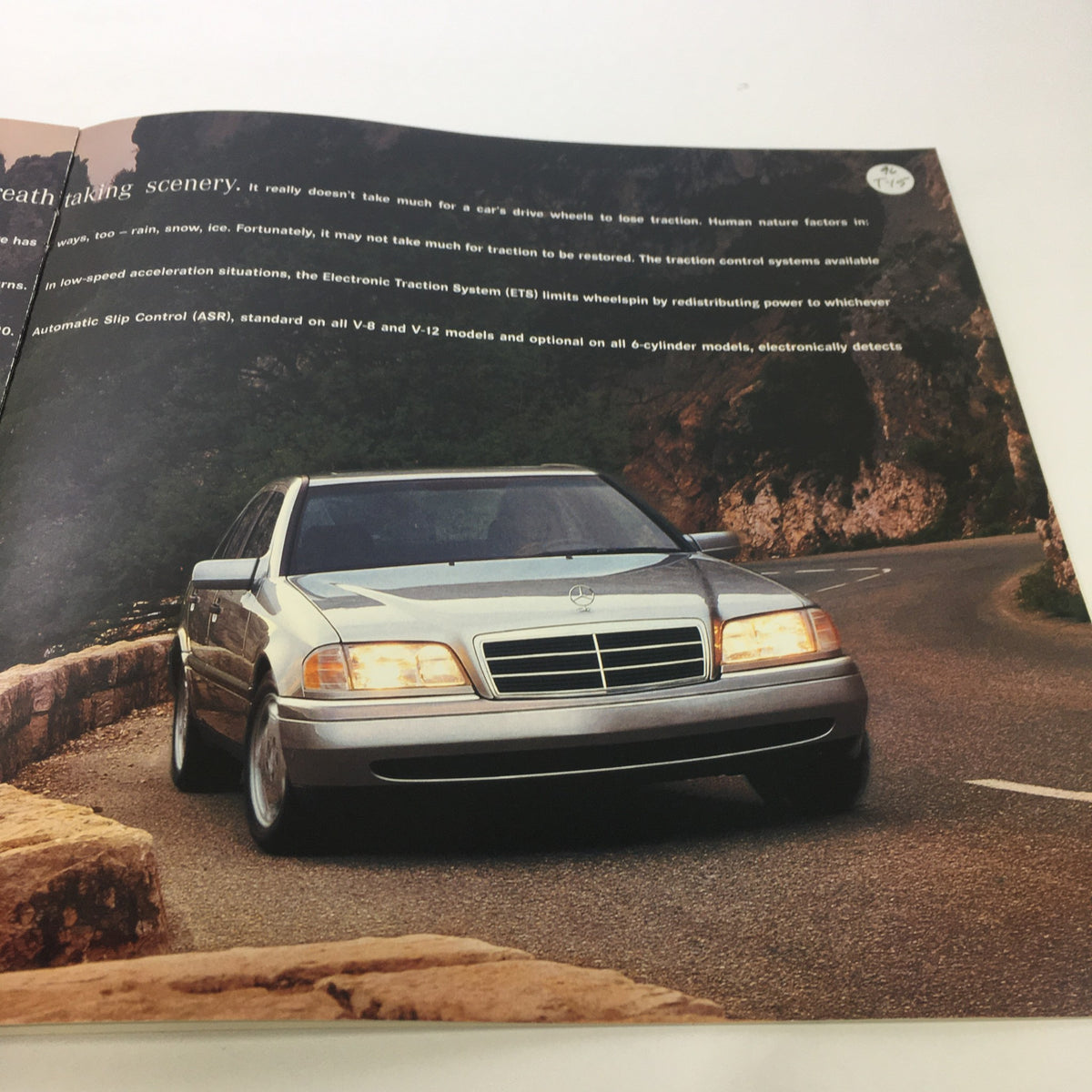Exterior shot of the 1996 Mercedes-Benz E-Class SL-Class dealership car auto brochure catalog demonstrating the vehicle on a scenic road.