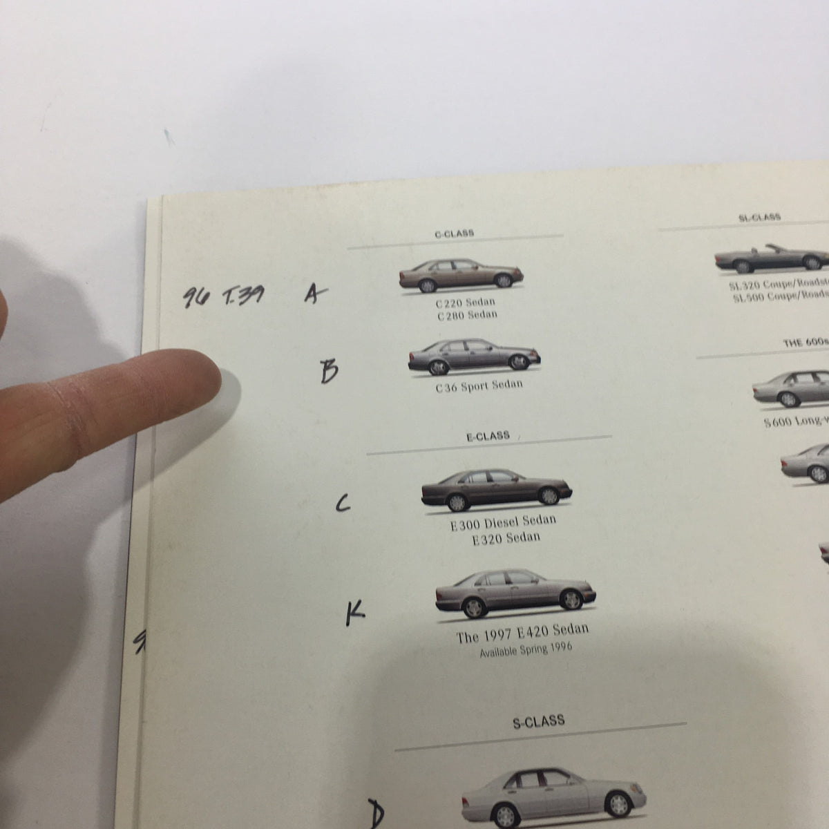 Detail of the back cover of the 1996 Mercedes-Benz E-Class SL-Class Dealership Car Auto Brochure Catalog highlighting model specifications.