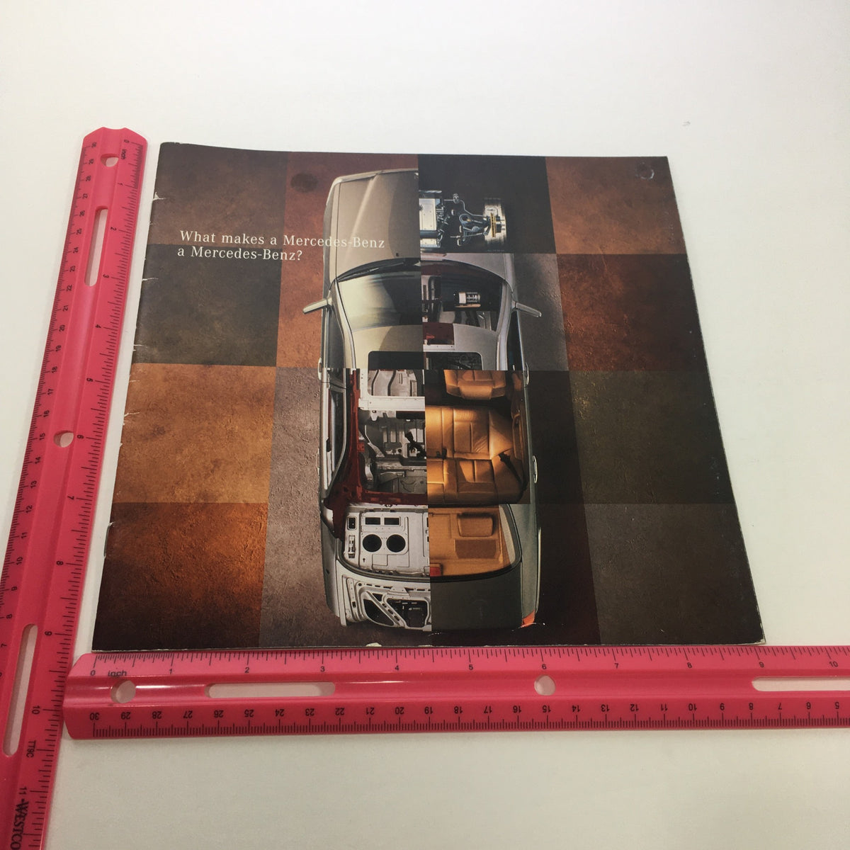 Front cover of the 1996 Mercedes-Benz E-Class SL-Class Dealership Car Auto Brochure Catalog with an artistic layout showing the car's interior.