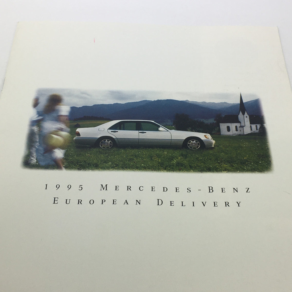 Front cover of the 1995 Mercedes-Benz European Delivery Dealership Car Auto Brochure Catalog featuring a silver Mercedes-Benz car in a scenic landscape.