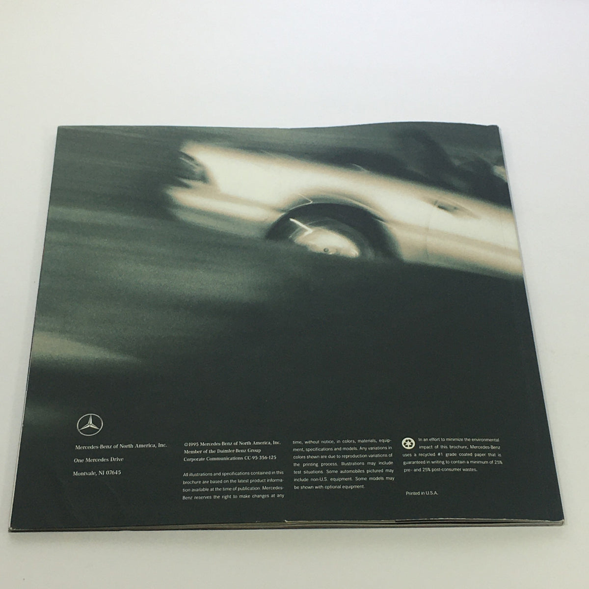 Back cover of the 1996 Mercedes-Benz Dreams SL-Class Dealership Car Auto Brochure Catalog, displaying a blurred image of a Mercedes-Benz vehicle.