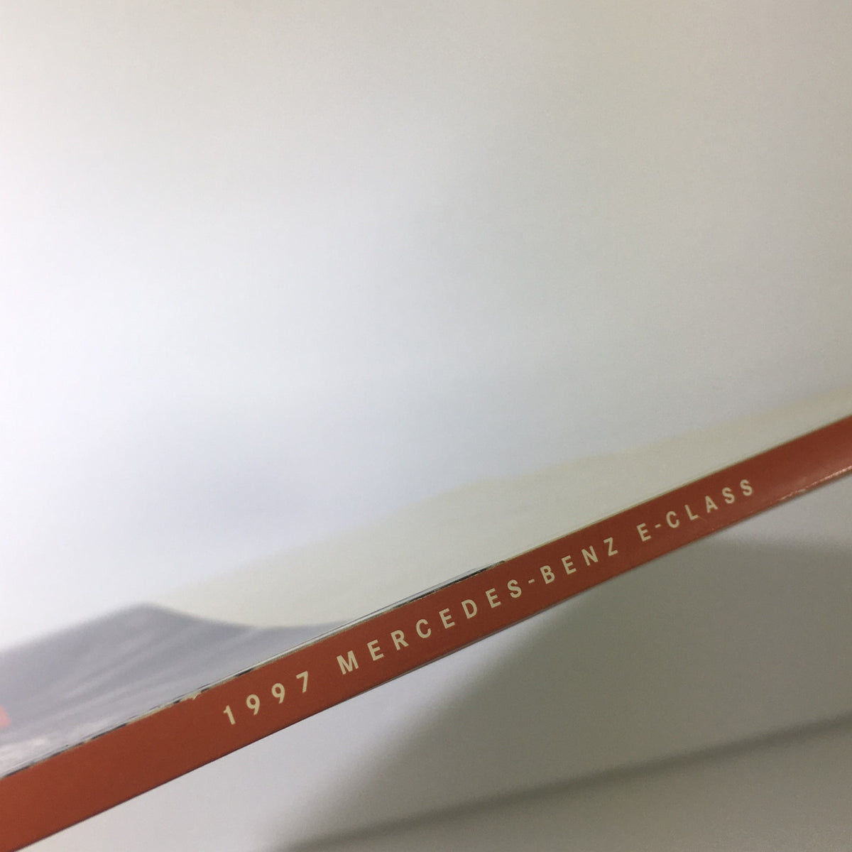 Spine view of the 1997 Mercedes-Benz E-Class Dealership Car Auto Brochure Catalog showing the title on the edge.