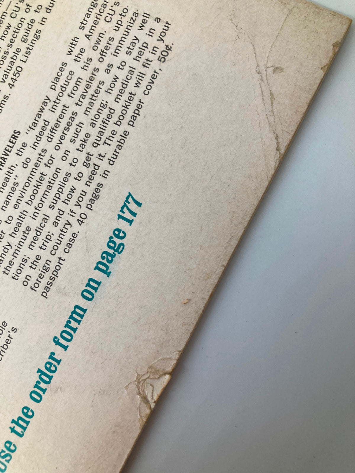 Detail of the back cover of VTG Consumer Reports Magazine March 1967, displaying old text and small damage marks, highlighting the magazine's historical significance and collectible condition.