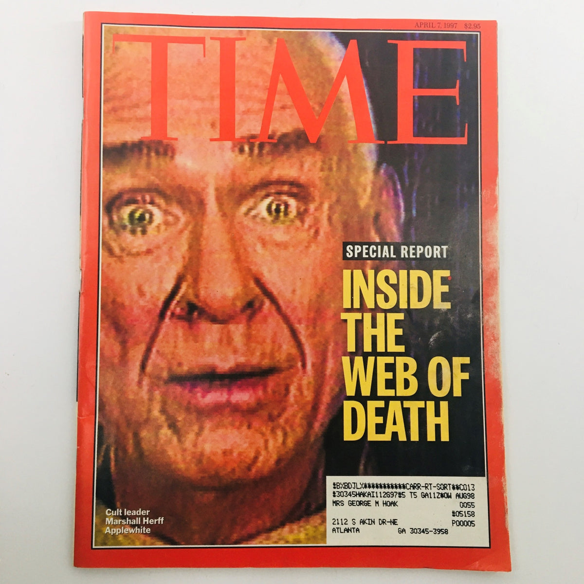 Time Magazine cover dated April 7, 1997, featuring a close-up of cult leader Marshall Herff Applewhite with expressive eyes. The cover headline reads 'Inside the Web of Death' as part of a special report.