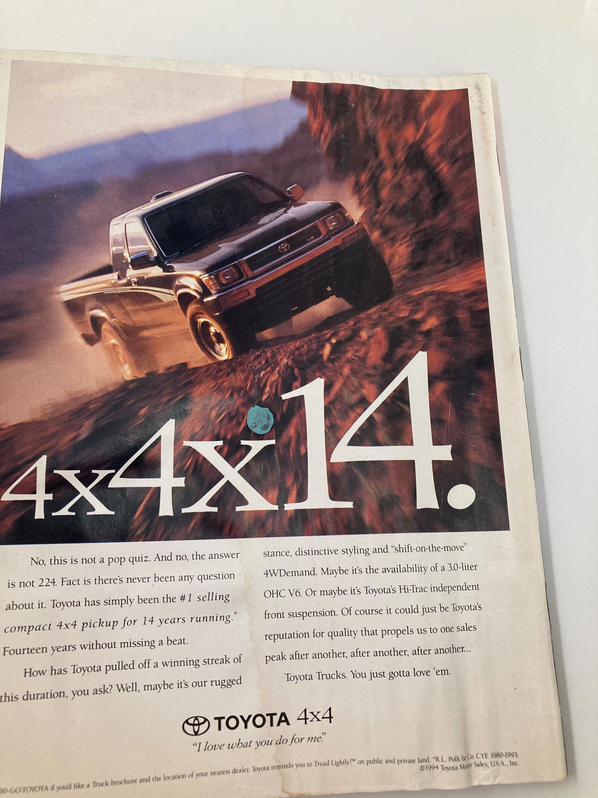 Back cover of Petersen's 4 Wheel & Off-Road Magazine October 1994 featuring an advertisement for Toyota 4x4 vehicles, showcasing an off-road pickup truck in action.