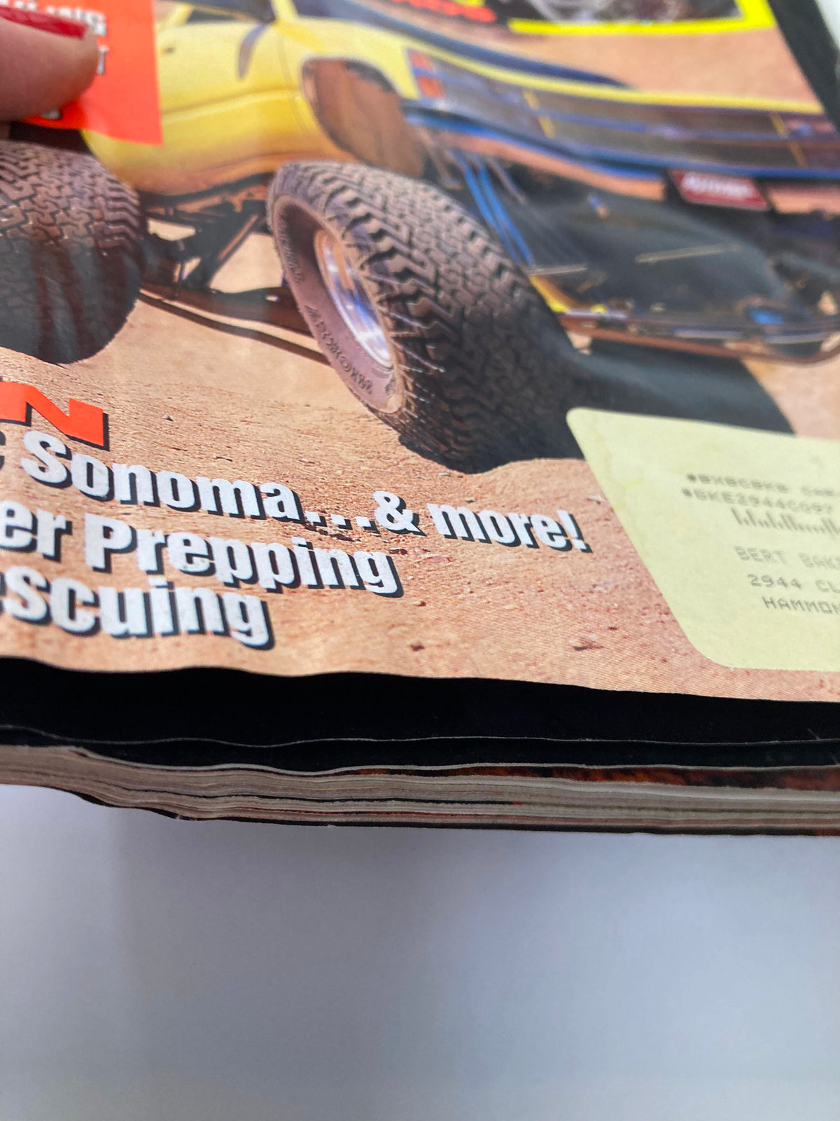 Side view of the Petersen's 4 Wheel & Off-Road Magazine, November 1994, showing the magazine's spine and minor wear and tear indicative of its age.