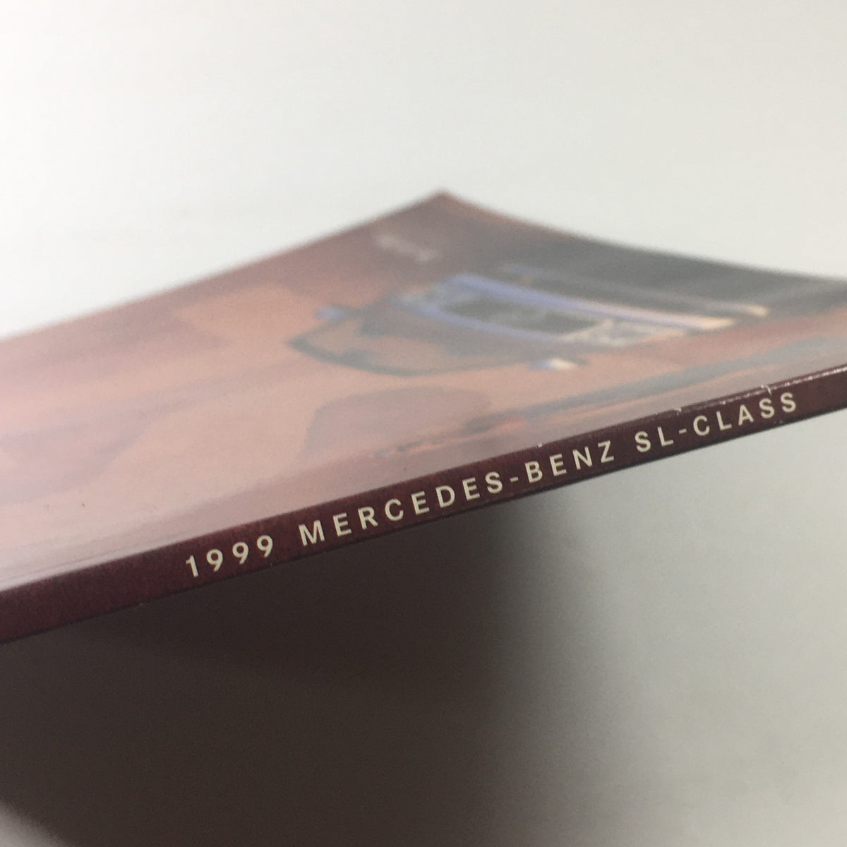 Side view of the 1999 Mercedes-Benz SL-Class brochure, showcasing the title and sleek design.