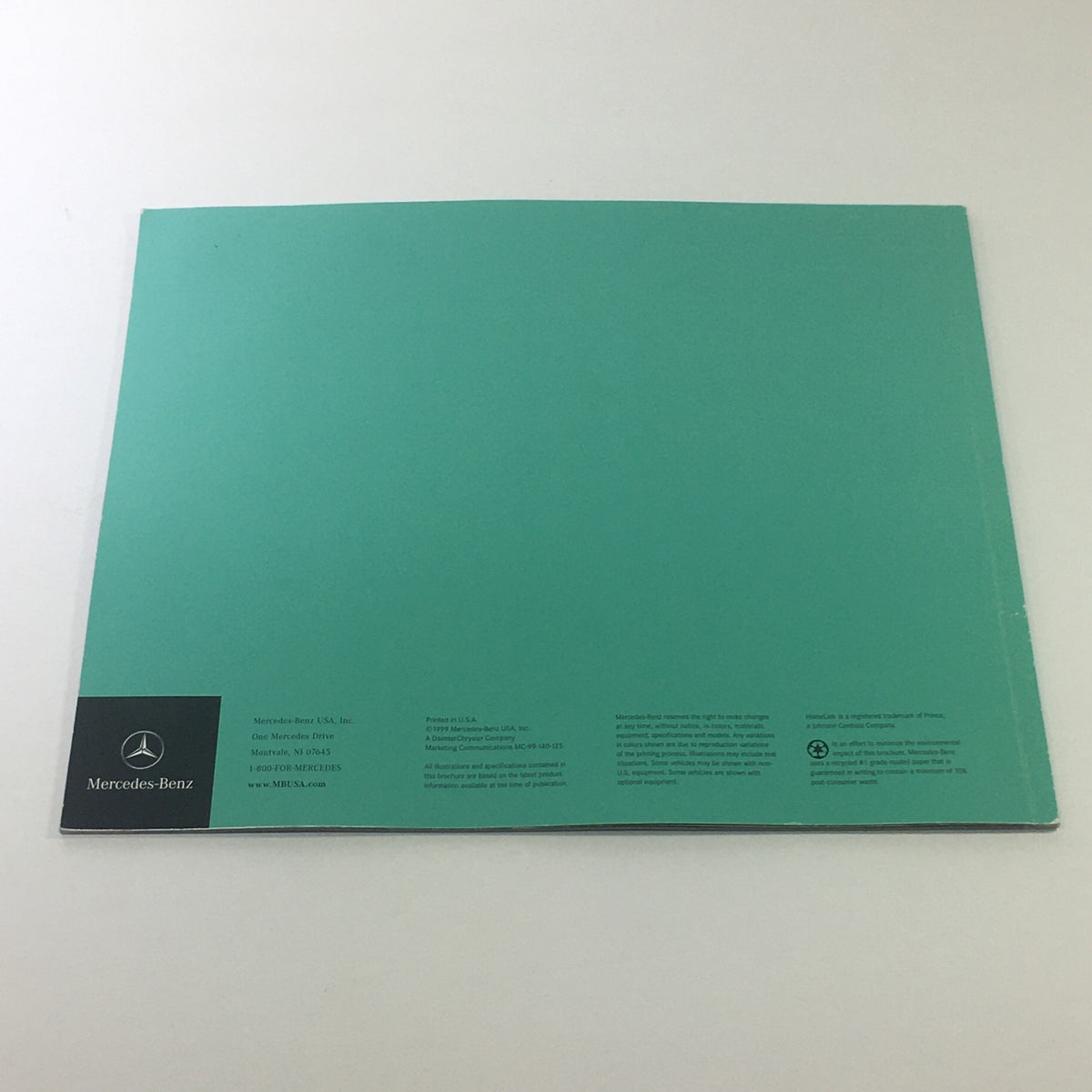 Back cover of the 2000 Mercedes-Benz SLK Designo Editions dealership car auto brochure catalog, featuring the Mercedes-Benz logo and contact information.
