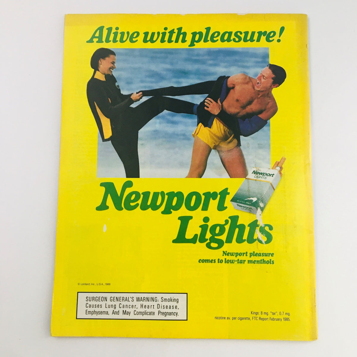 Cover of Newport Lights advertisement cigarette magazine, vibrant yellow background with a playful seaside scene and tagline 'Alive with pleasure!' This vintage piece showcases promotional style of the era.