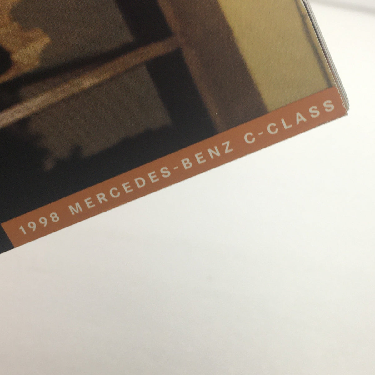 Detail view of the 1998 Mercedes-Benz C-Class dealership brochure featuring the title on the cover.