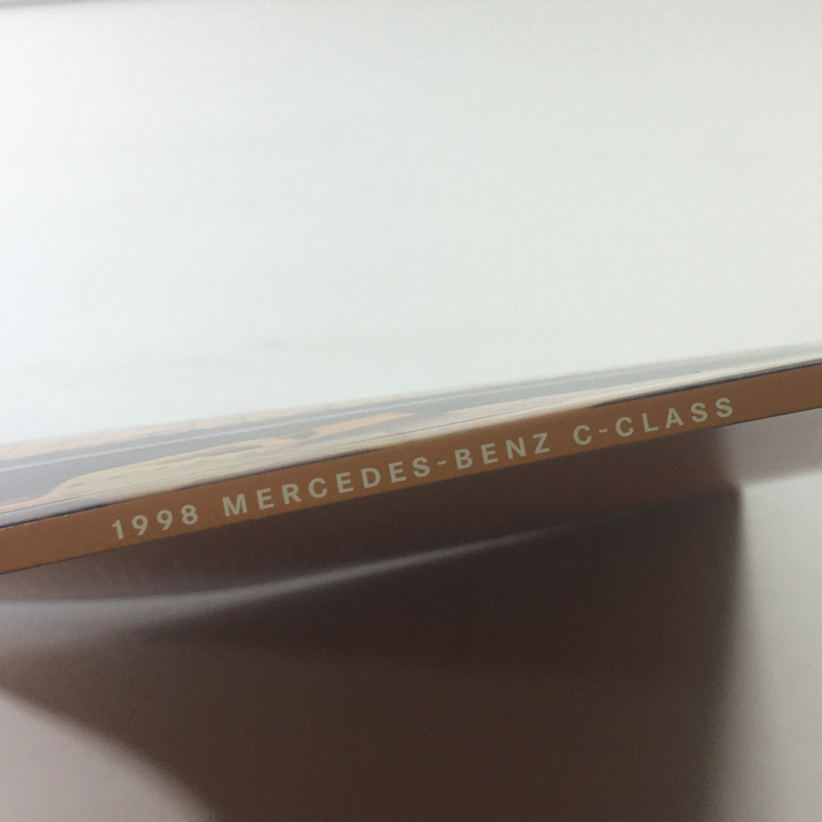 Side view of the 1998 Mercedes-Benz C-Class brochure displaying the title prominently.