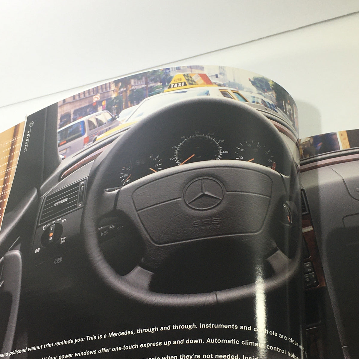 Interior page of the 1998 Mercedes-Benz C-Class brochure highlighting the steering wheel and dashboard features.