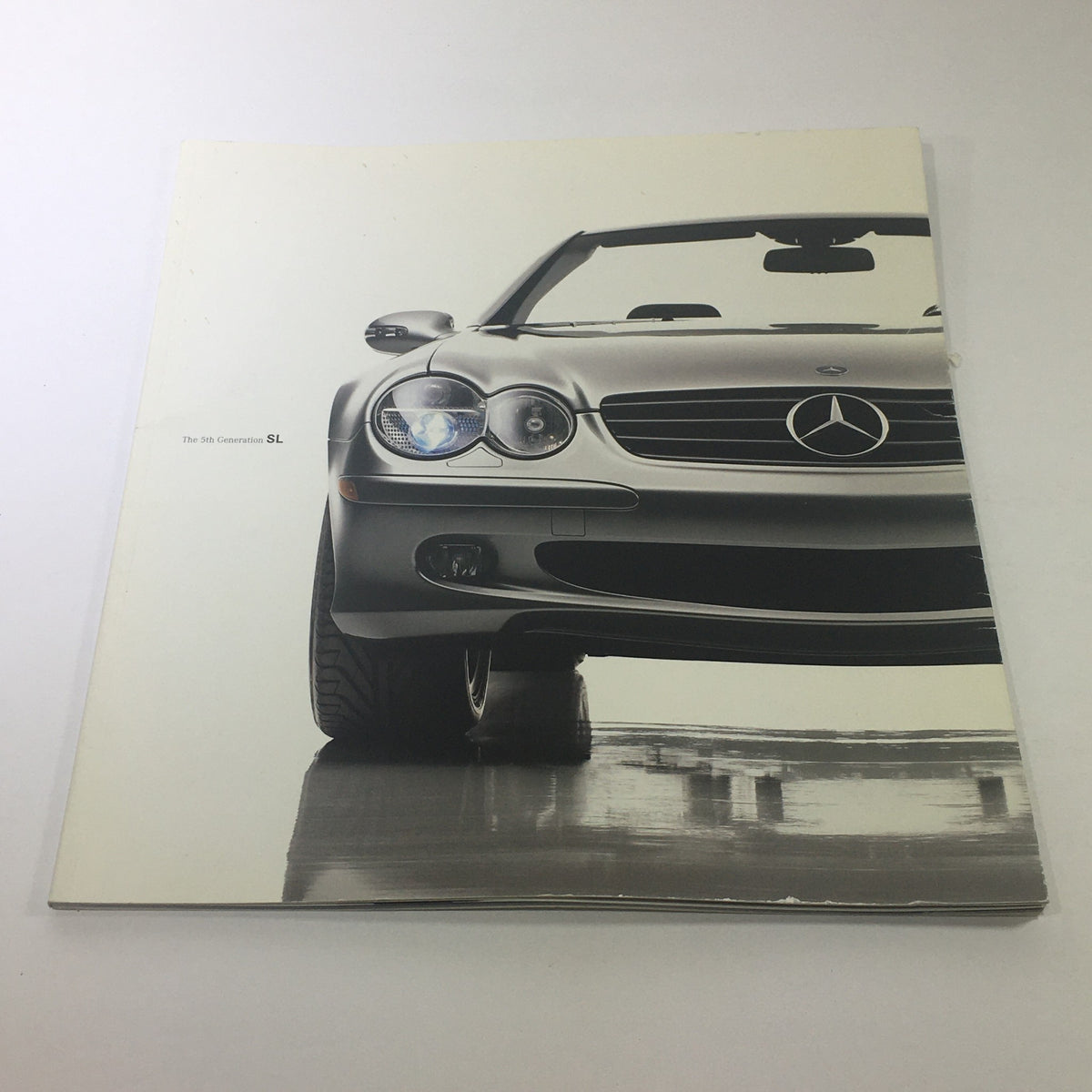 2003 Mercedes-Benz 5th Generation SL-Class Dealership Car Auto Brochure Catalog cover featuring a sleek silver SL-Class in a polished setting.