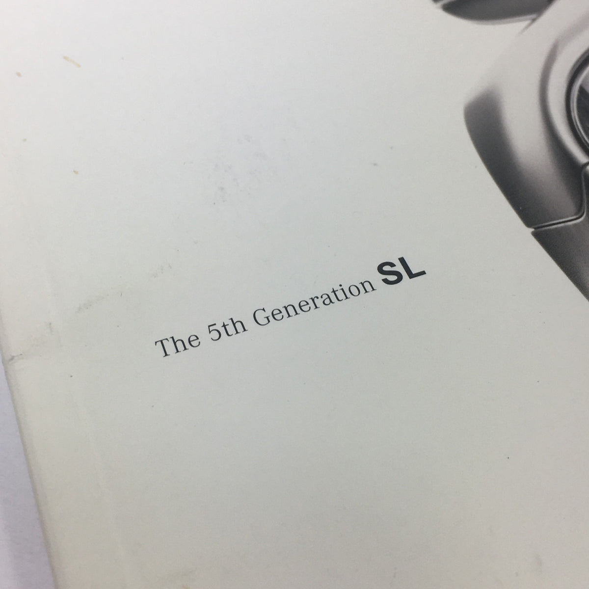 Close-up view of the title 'The 5th Generation SL' on the cover of the 2003 Mercedes-Benz SL-Class Dealership Car Auto Brochure Catalog.