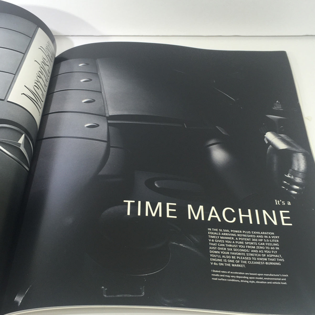 2003 Mercedes-Benz 5th Generation SL-Class Dealership Car Auto Brochure Catalog page showcasing the interior design with a caption 'It's a TIME MACHINE' emphasizing the powerful driving experience.