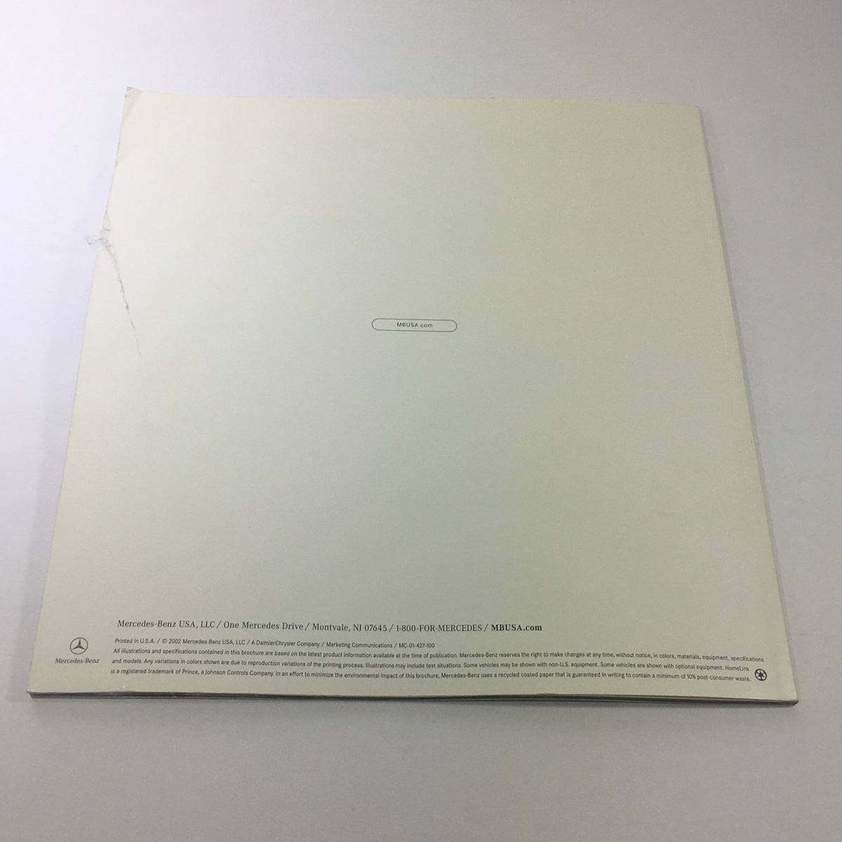 Back cover of the 2003 Mercedes-Benz 5th Generation SL-Class Dealership Car Auto Brochure Catalog showing the brand logo and contact information.