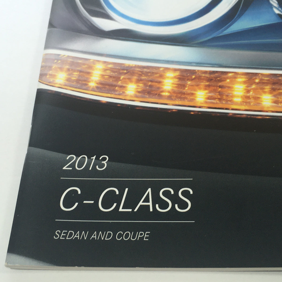 Cover page of the 2013 Mercedes-Benz C-Class Sedan and Coupe Dealership Car Auto Brochure Catalog featuring the title 'C-Class' and an elegant design.