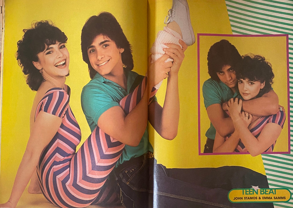 Teen Beat Magazine June 1983 highlights an energetic pose of John Stamos and Emma Samms, both smiling and having fun against a vibrant yellow background. A nostalgic piece capturing '80s celebrity culture.