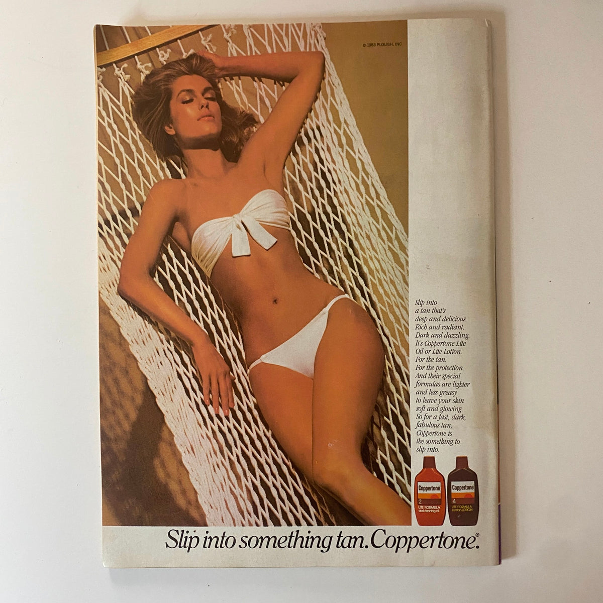 Teen Beat Magazine July 1983 featuring a woman in a white bikini lounging in a hammock, advertising summertime beauty and fashion.