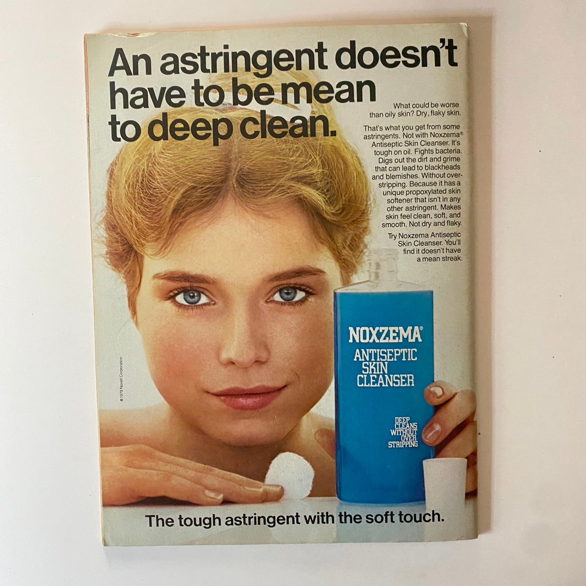 Noxzema Antiseptic Skin Cleanser advertisement featuring a young woman applying the product. The ad promotes skincare and highlights the benefits of the cleanser.