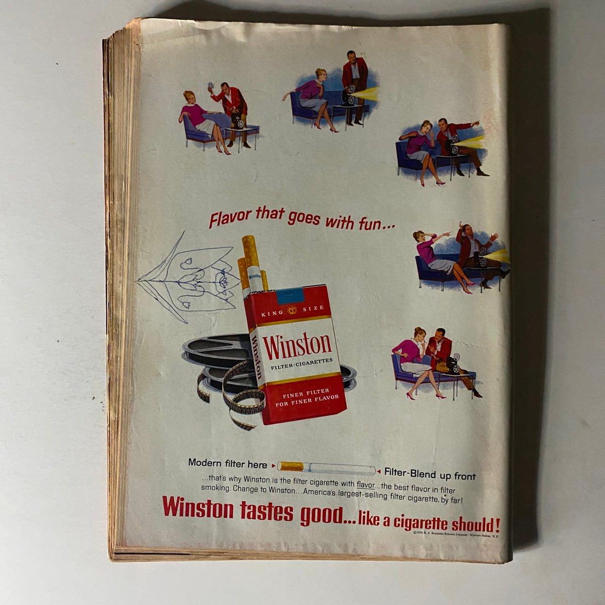 Vintage advertisement page from Time Magazine, promoting Winston Filter Cigarettes, showcasing 1960s social culture with illustrations of couples in a lively setting.