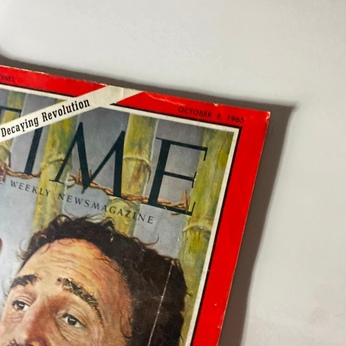 Close-up view of the Time Magazine cover from October 8, 1965, depicting Fidel Castro and illustrating the theme 'The Decaying Revolution'. This vintage magazine captures a pivotal moment in Cuba's history.