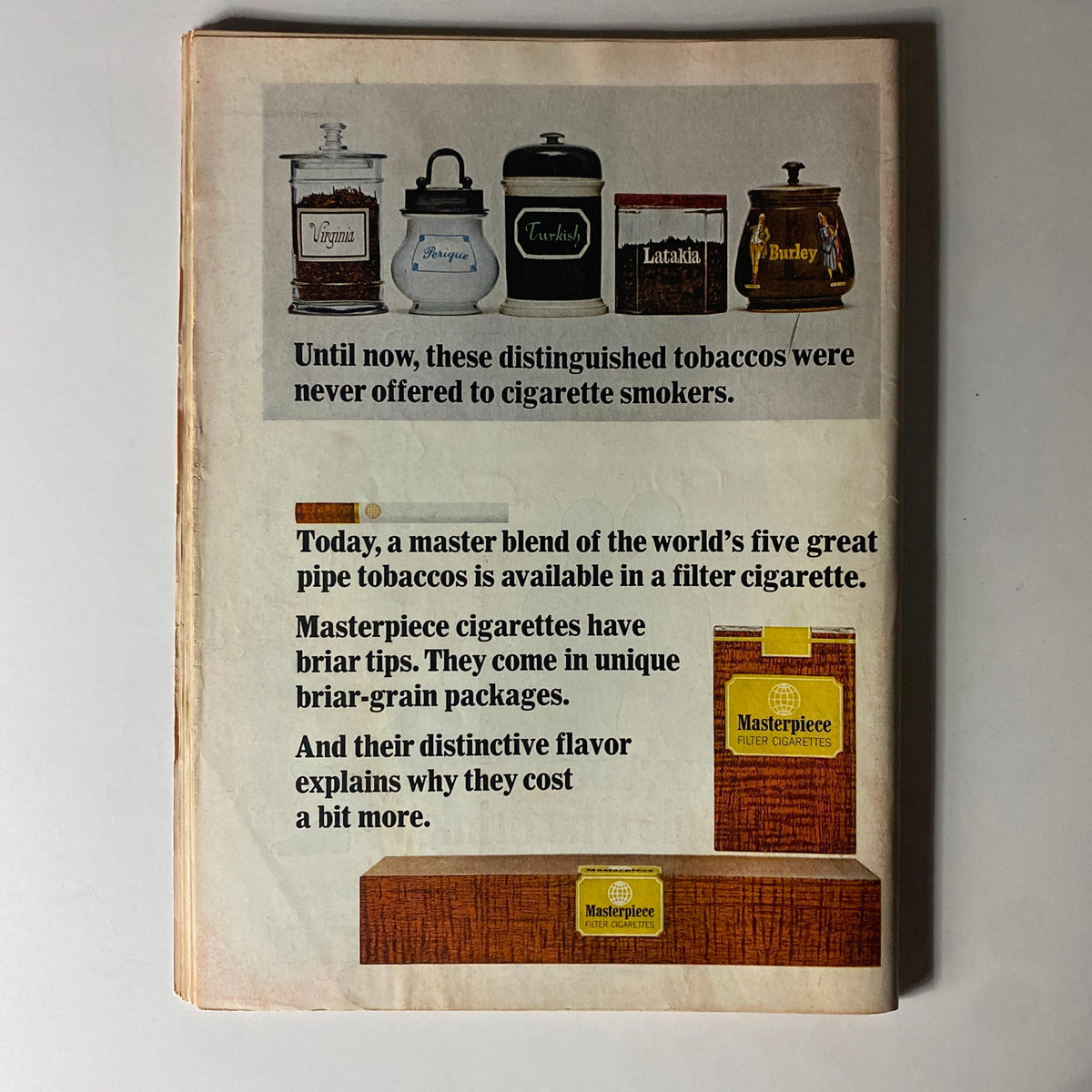 Back cover of Time Magazine from September 10, 1965, featuring an advertisement for Masterpiece filter cigarettes with visuals of various pipe tobacco jars.
