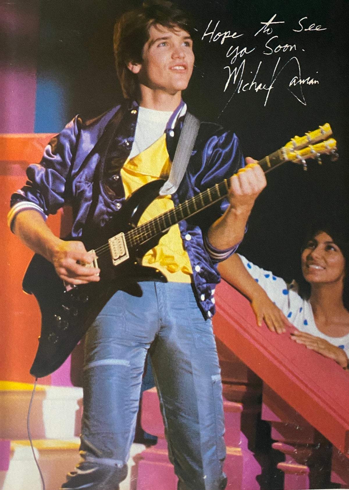 Image of Michael Damian performing on stage, wearing a stylish outfit, from Tiger Beat Magazine August 1982.