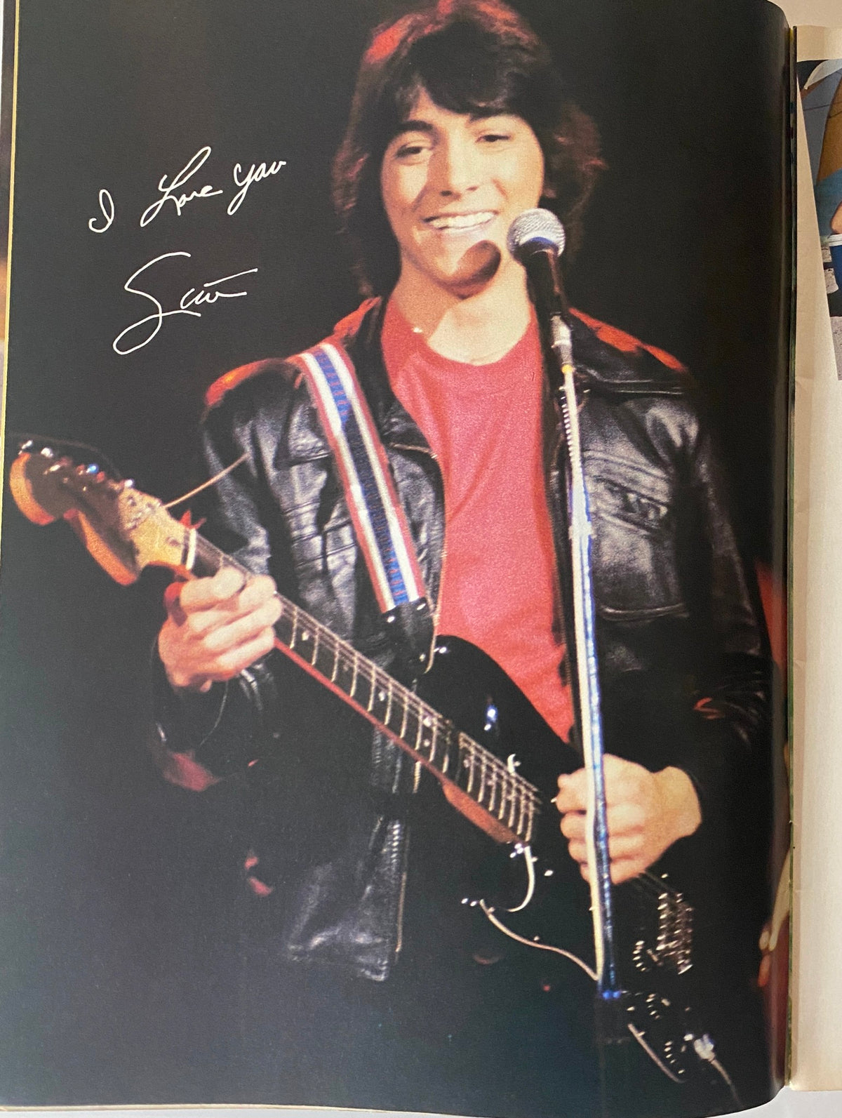 Scott Baio singing with a guitar on stage, featured in Tiger Beat Magazine August 1982.