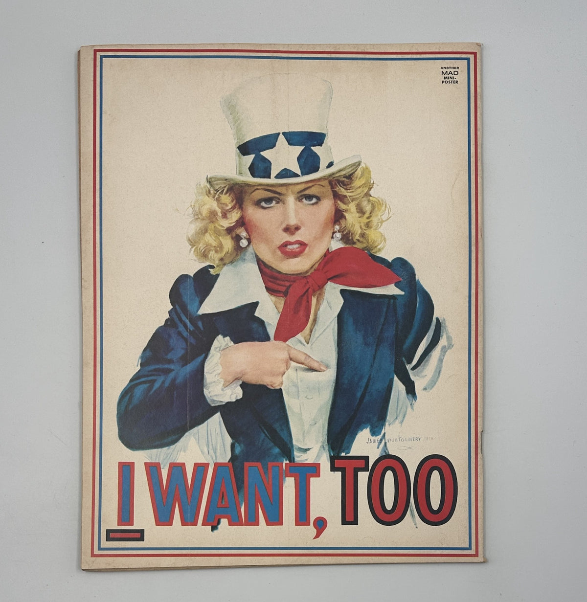 Back cover of MAD Magazine No. 182 from April 1976, showcasing an illustration of a woman dressed as Uncle Sam with the bold text 'I WANT, TOO.' This cover adds to the satirical tone of the magazine.