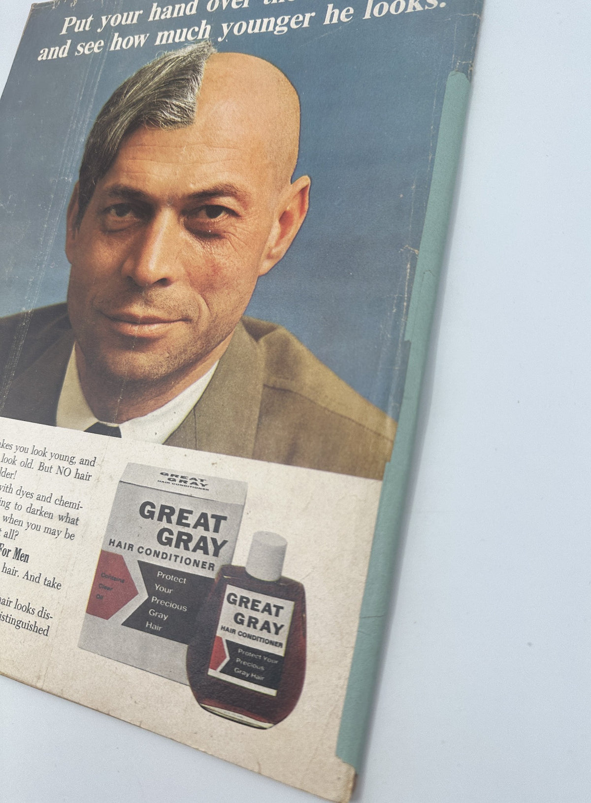 Back cover of MAD Magazine No. 112 from July 1967 advertising Great Gray Hair Conditioner, showing a man with half his head bald and half with hair, asking readers to put their hand over the bald half.