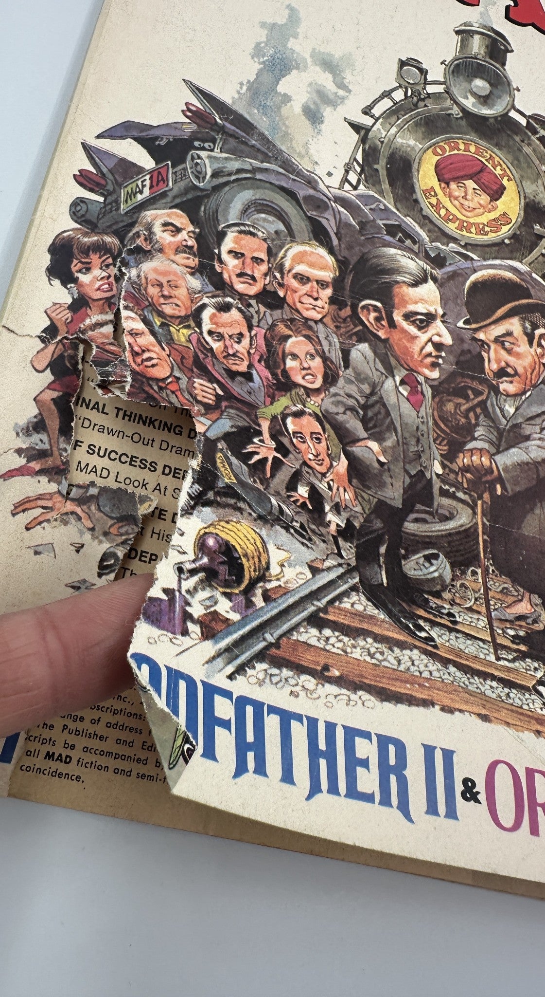 MAD Magazine No. 178 October 1975 cover detail featuring a humorous illustration from 'The Oddfather Part, Too'. Visible wear includes a folded corner and multiple characters caricatured in a comedic style.